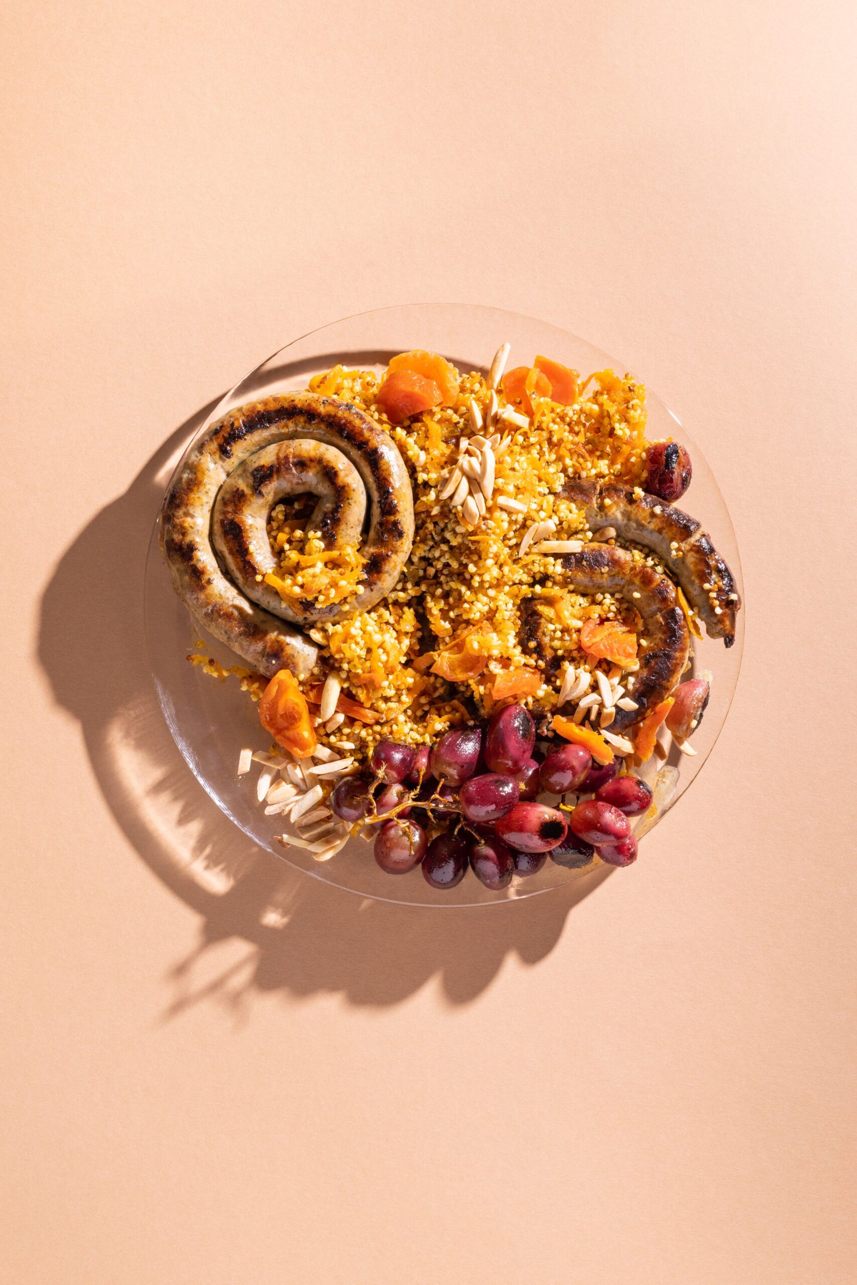 Warm Millet Sosatie Salad (Grilled Lamb, Roast Grapes, Curry Spices and Apricot)